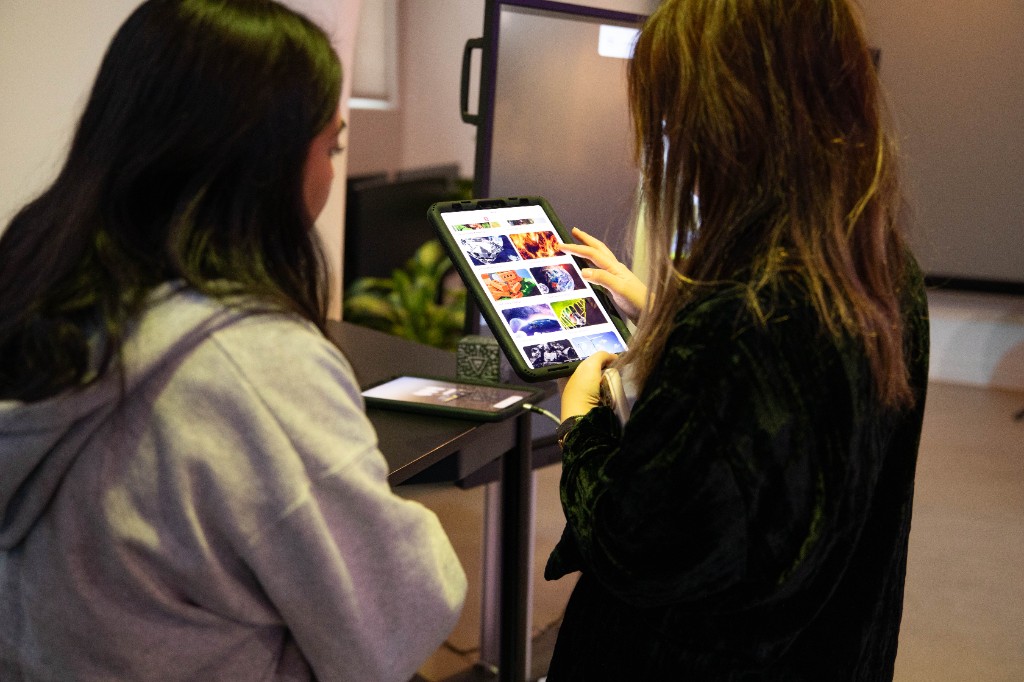 Participants exploring a digital image gallery on a tablet
